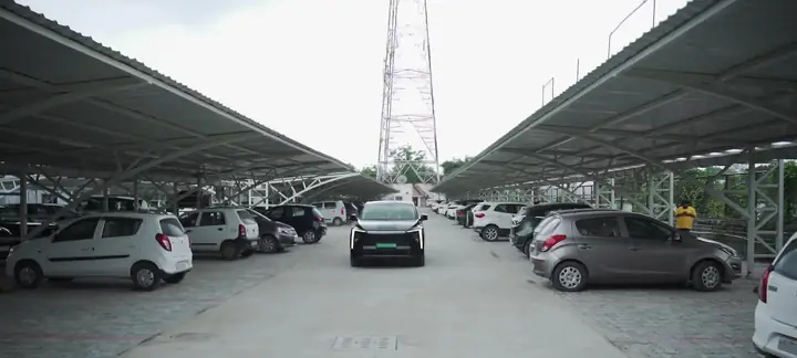 Parking aisle shaded by solar carports on both sides