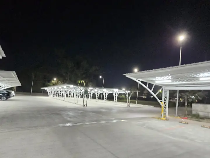 Solar carport rows lit at night