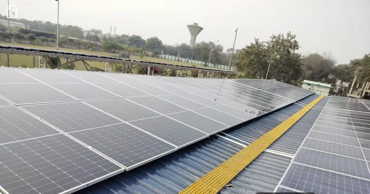 Solar panels on the carport roof with a walkway