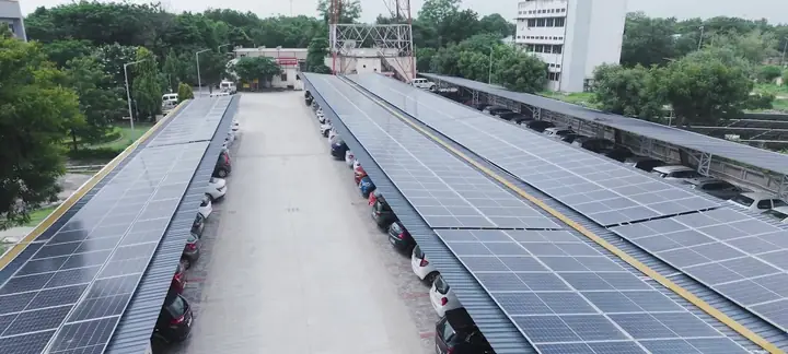 Rows of solar carports over a parking lot at ONGC Mehsana
